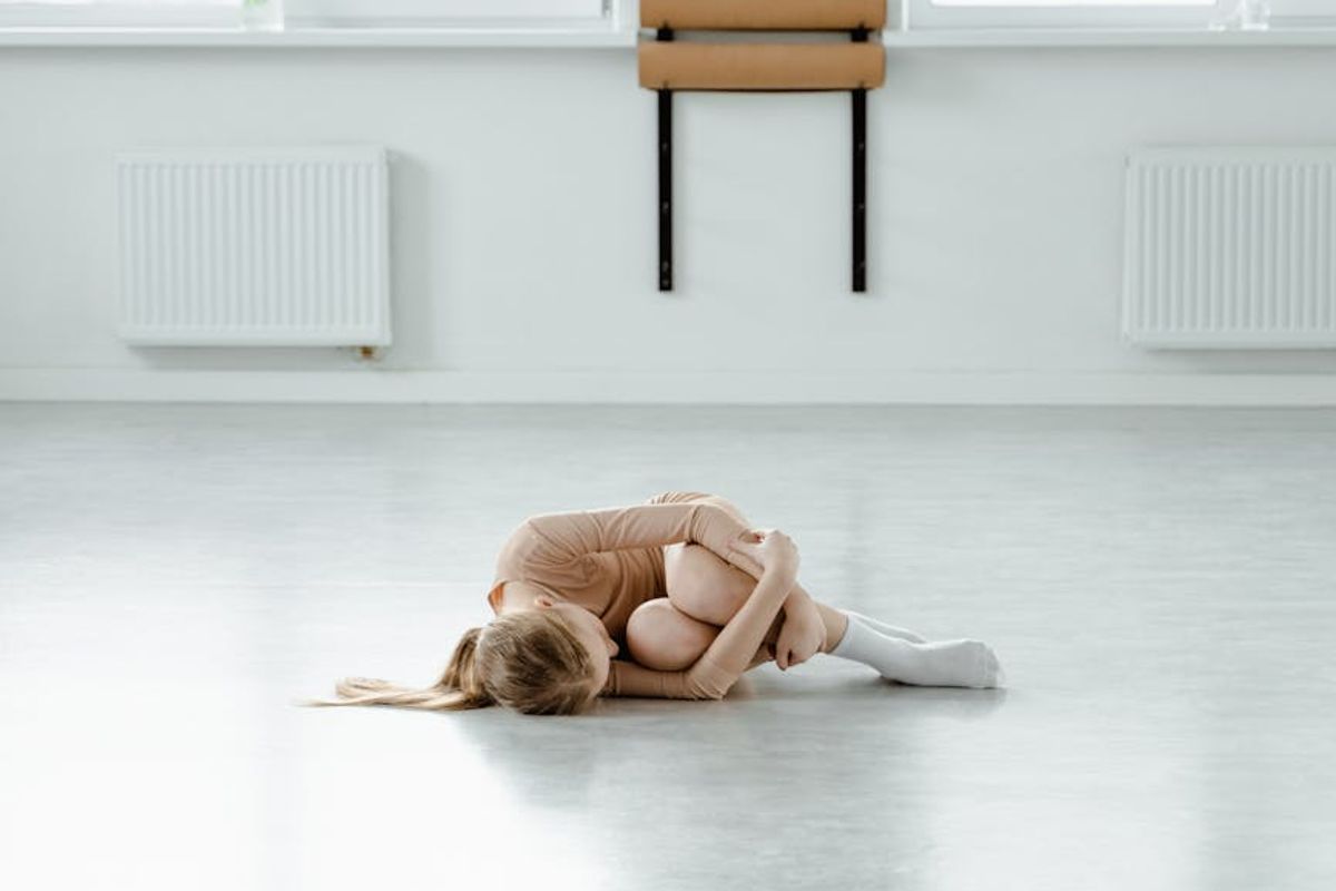 Minimalist yoga studio space with wooden floor and natural light